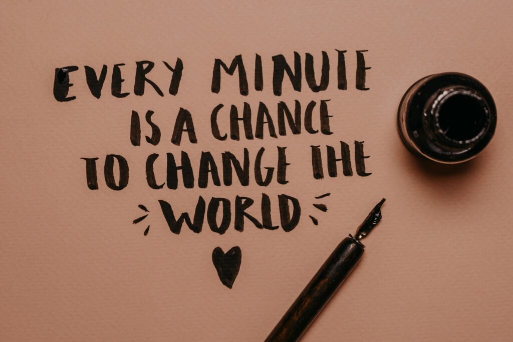 A motivational quote handwritten with a fountain pen, inspiring change and positivity.